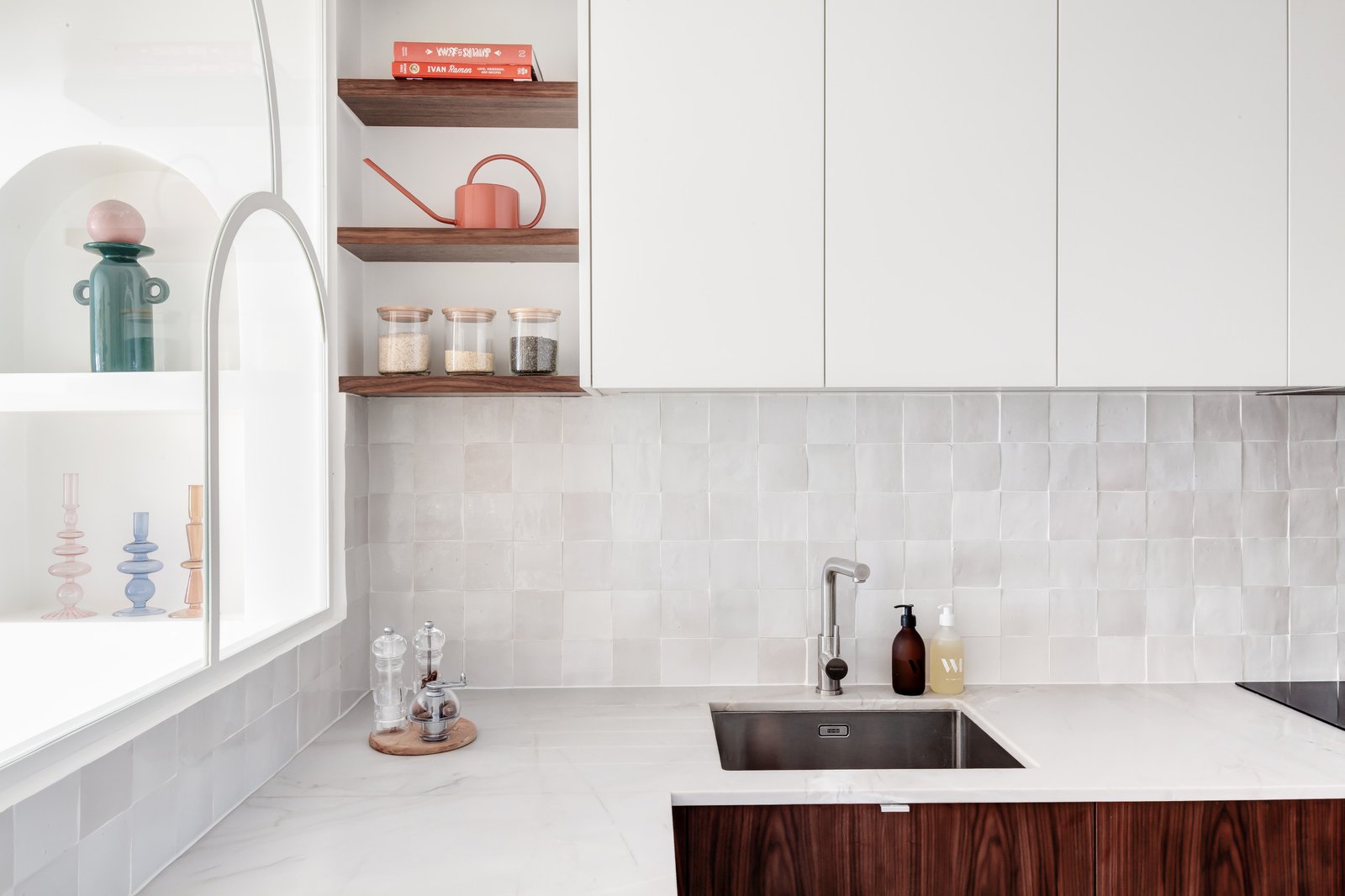 Open kitchen with handleless wood-grain cabinetry and stone island