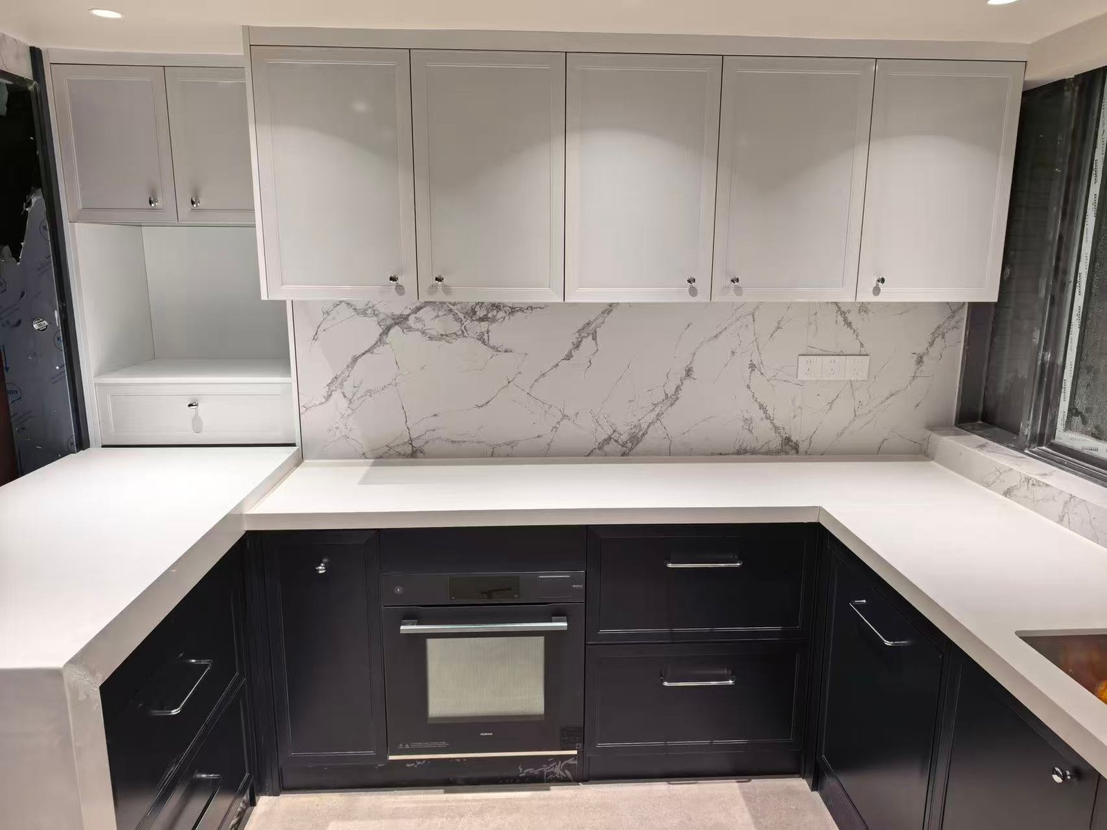 Built-in oven and island counter kitchen cabinets