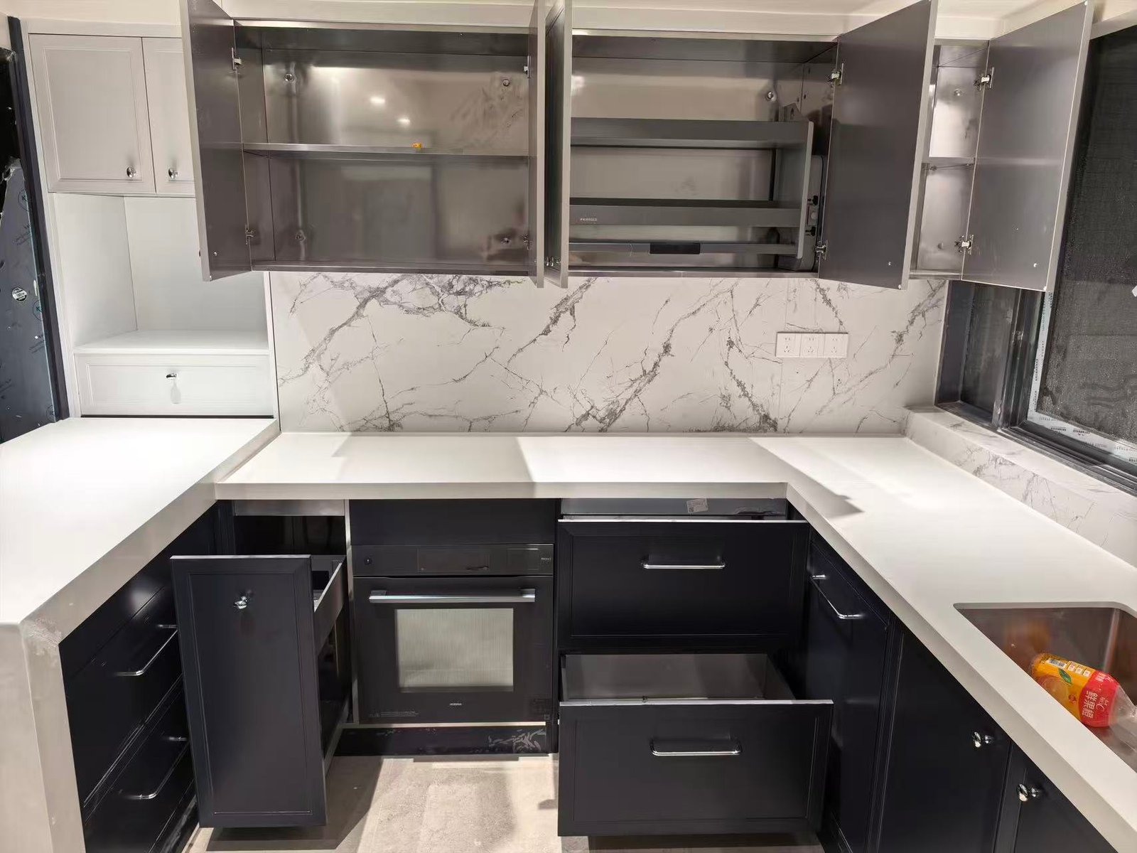 L-shaped kitchen with custom island bench cabinetry