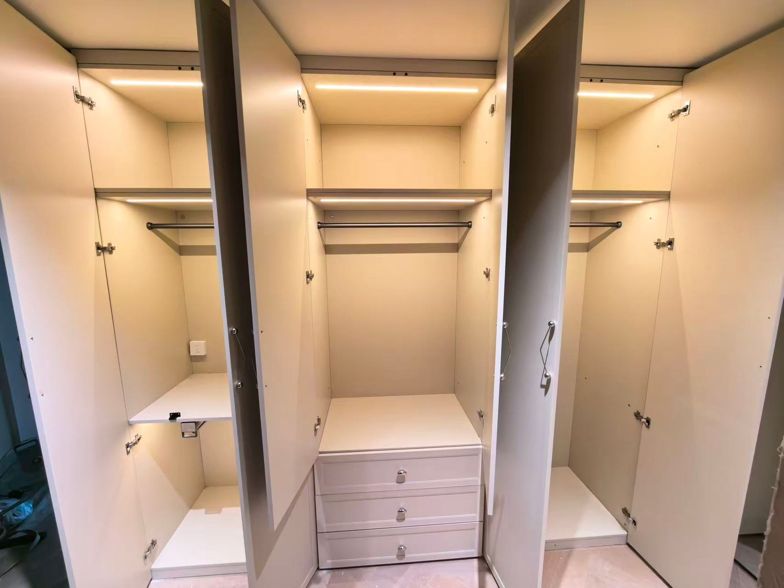 Open walk-in wardrobe with LED light hanging storage