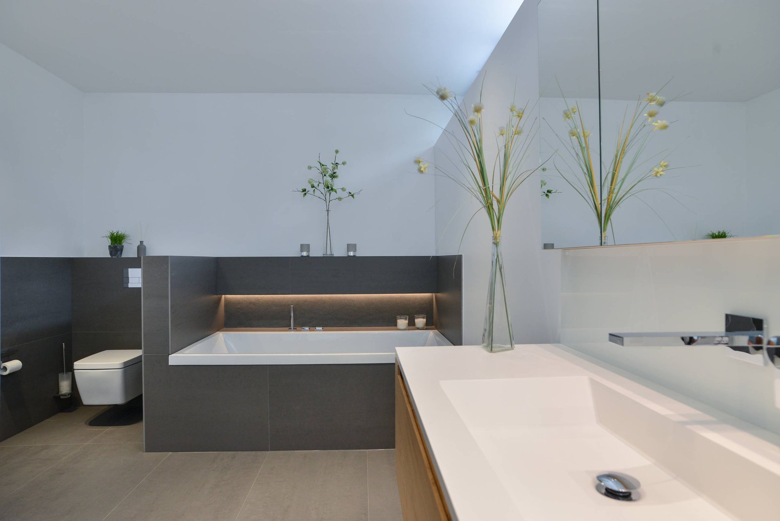 Spa-style walk-in shower in tones matched to the vanity program