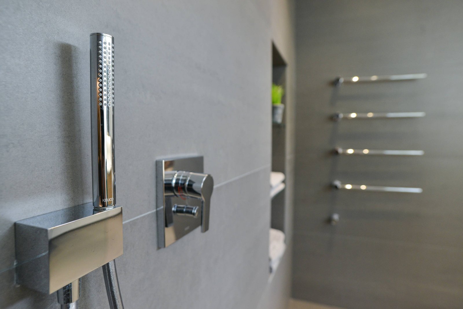 Backlit LED mirror above a floating vanity unit