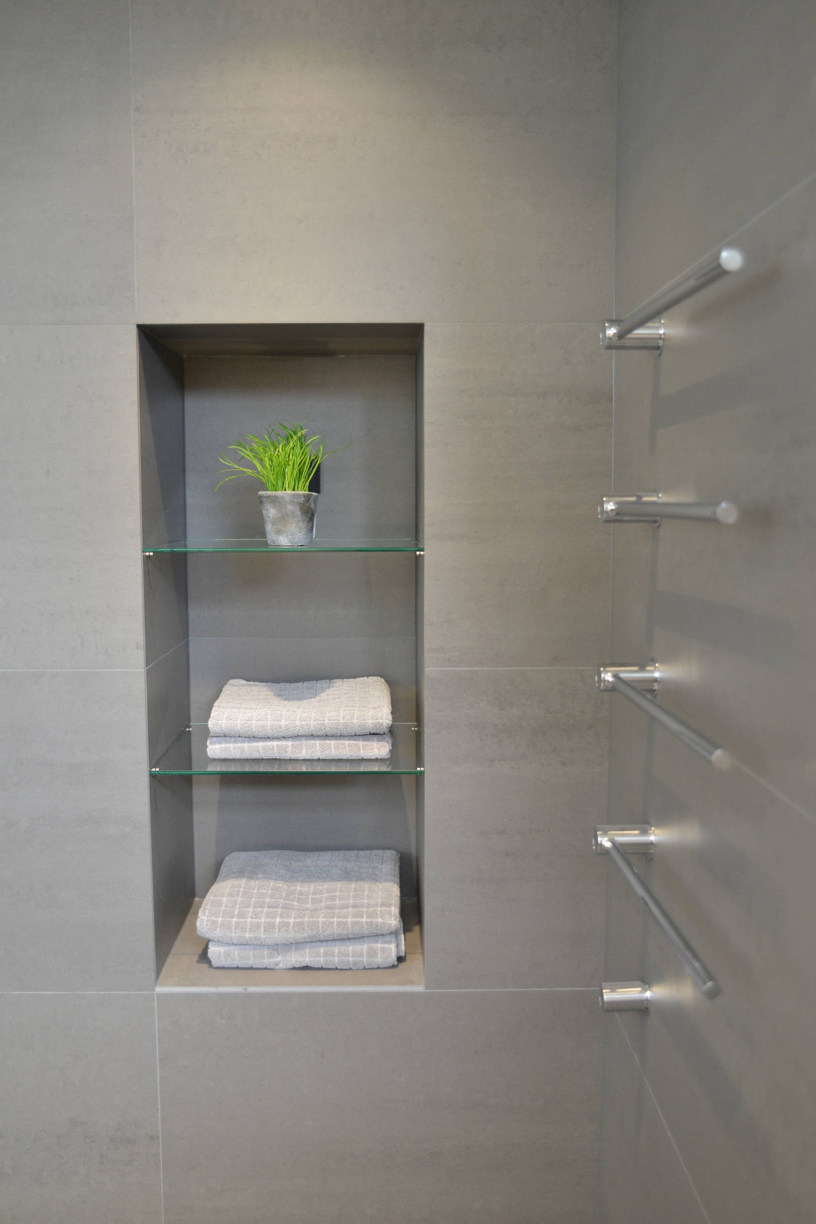 Guest bathroom with wall-mounted vanity and storage tower